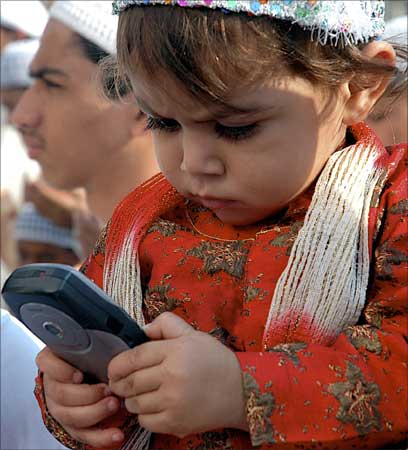 A child plays with a mobile