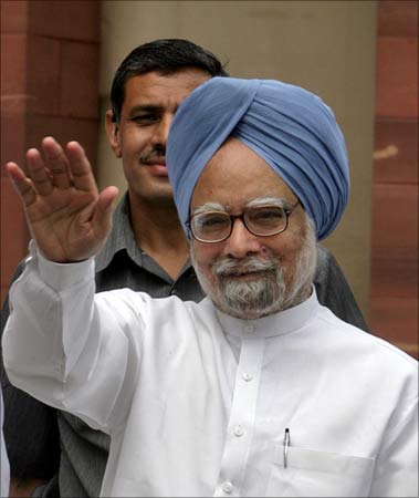 Prime Minister Manmohan Singh waves as he arrives at Parliament on its opening day for the Budget Session in New Delhi.