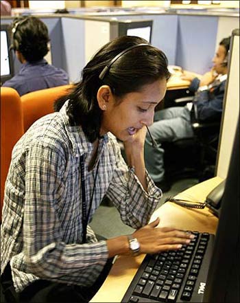 An Indian employees at a call centre provide service support to international customers.