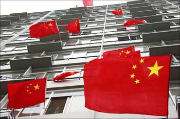 China's flags are displayed outside a dormitory building at the Beijing Institute of Technology.