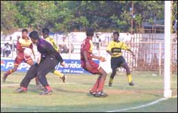 A S Firoze is set to slam the equaliser for Karnataka as TN 'keeper Edward advances. 