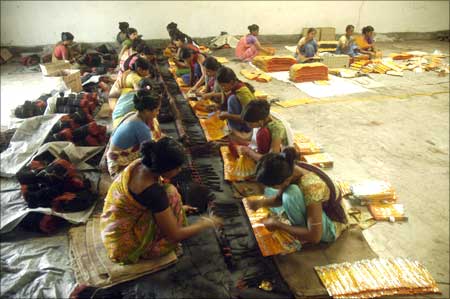 Women make incense sticks in a factory on the outskirts of Agartala.